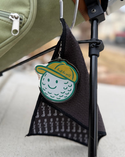 Keychain with a cartoon character attached to a bag handle