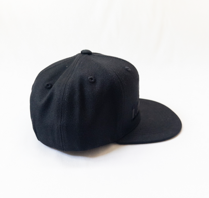 Black baseball cap on a white background