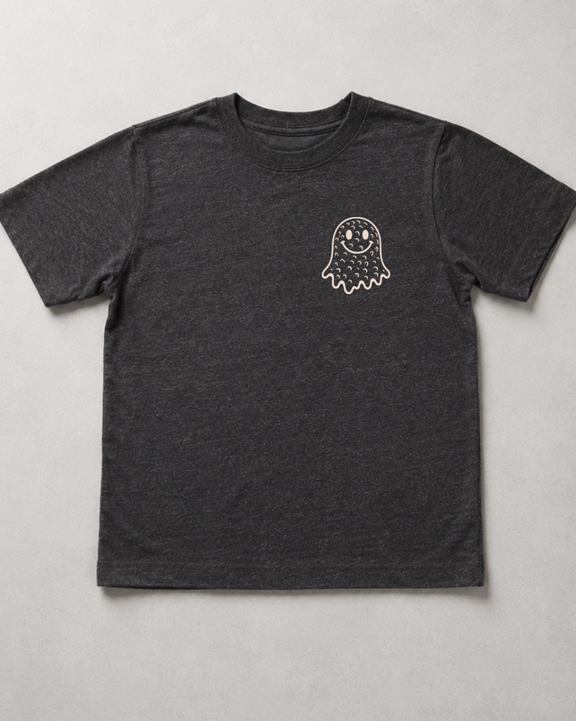 A dark heather gray short-sleeve t-shirt with a small white ghost graphic on the left chest, laid flat against a neutral light gray background.