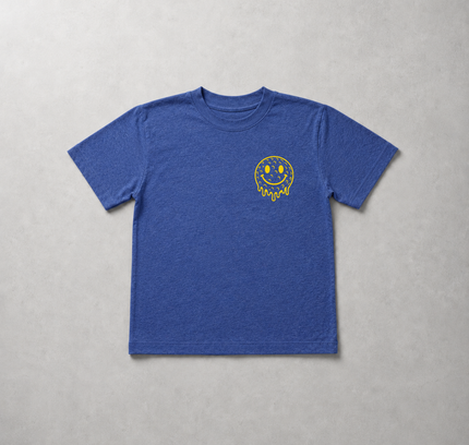 A heather blue short-sleeve t-shirt with a small yellow dripping smiley face graphic on the left chest, laid flat on a textured gray background.
