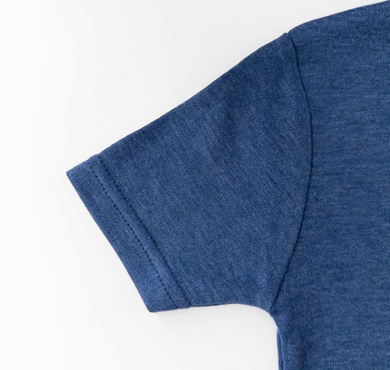 Close-up of a blue t-shirt sleeve on a white background