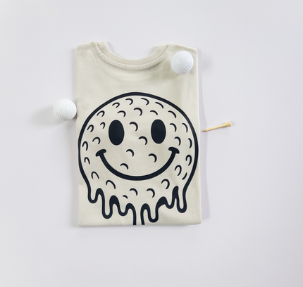 Beige t-shirt with a black smiley face design on a white background