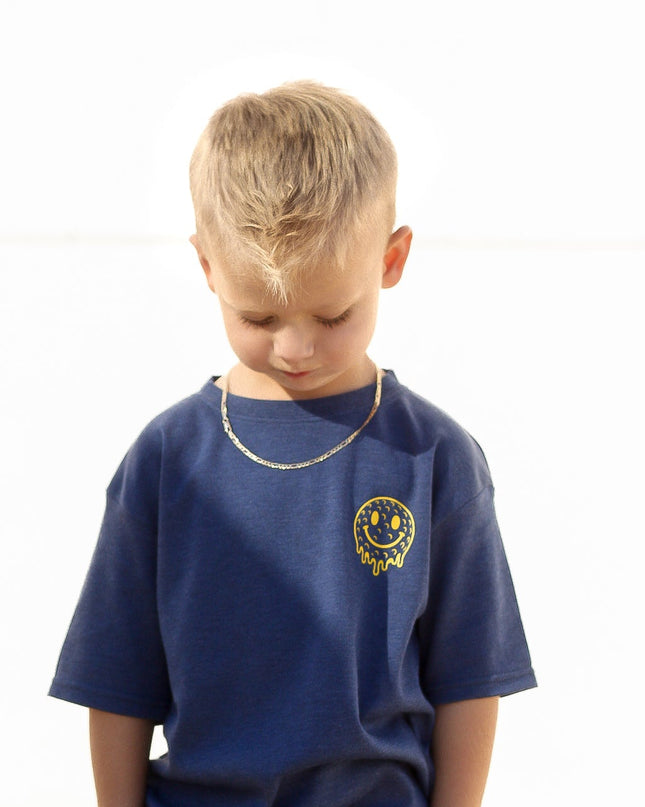 Child wearing a blue t-shirt with a logo on a white background