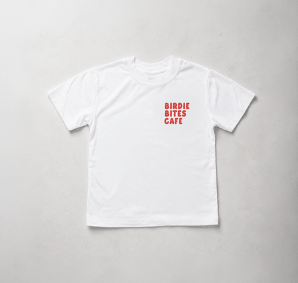 A white short-sleeve crewneck t-shirt with 'BIRDIE BITES CAFE' printed in red text on the left chest, laid flat on a light gray background.