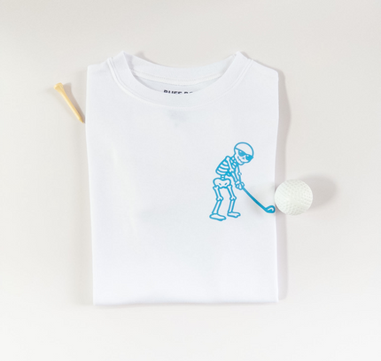 White t-shirt with blue graphic of a person playing golf on a white background