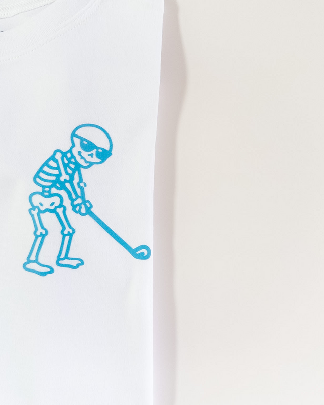White t-shirt with blue skeleton design on a white background
