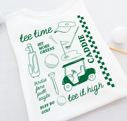 Golf-themed shirt with green text and graphics on a white background