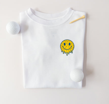 White kids t-shirt with a smiley face design on a light gray background