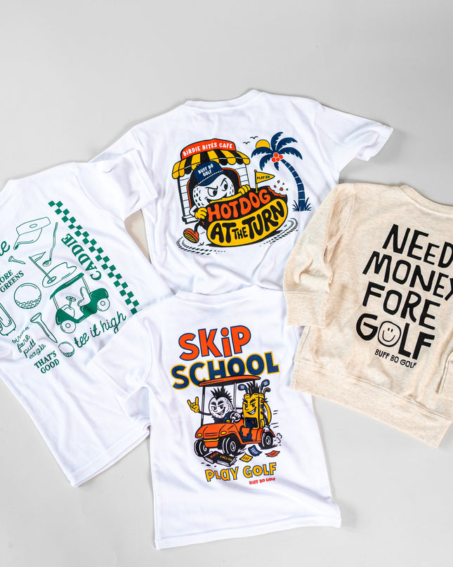 Four golf-themed apparel items arranged on a light gray background: two white graphic T-shirts, one cream graphic sweatshirt, and one white T-shirt shown from the back. The designs feature playful golf illustrations and text including 'HOT DOGS AT VIRNY', 'SKIP SCHOOL', 'NEED MONEY FORE GOLF', and 'too late to start golf'.