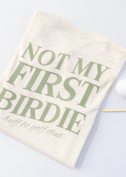 Golf towel with 'Not My First Birdie' text on a light background