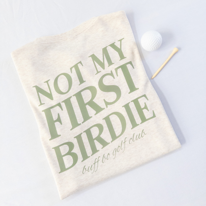 Golf towel with 'Not My First Birdie' text on a white background