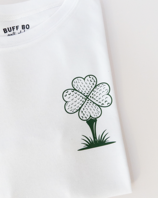 White t-shirt with a four-leaf clover graphic and 'BUFF GO' text on a light background