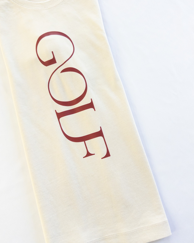 Beige tshirt with 'GOLF' printed in red on a white background