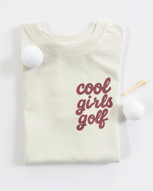 Beige t-shirt with 'cool girls golf' text on a white background
