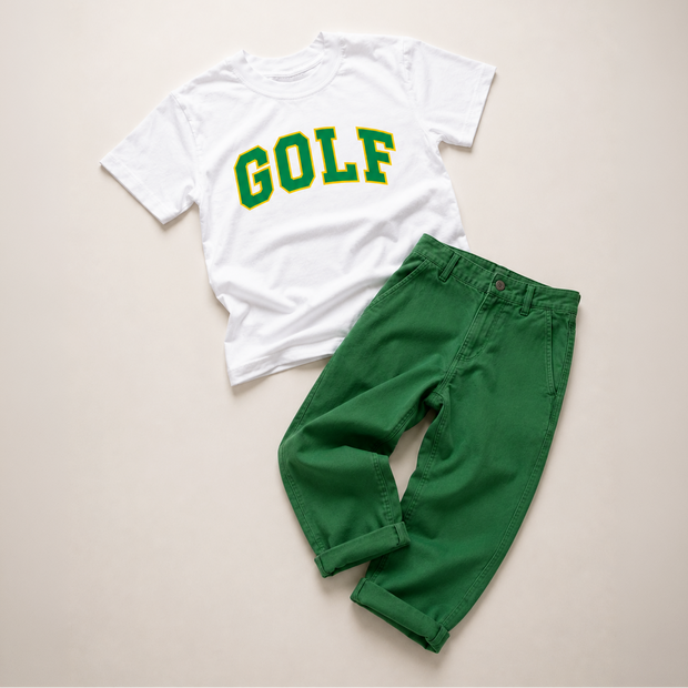 A children's two-piece outfit laid flat on a light beige background, featuring a white short-sleeve T-shirt with 'GOLF' printed in green and yellow varsity lettering, paired with bright green pants.
