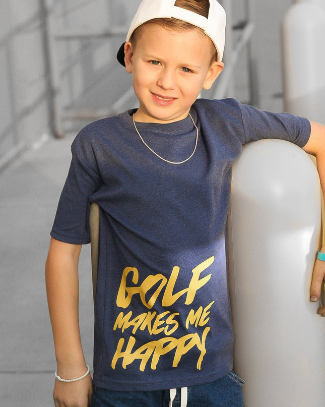 Child wearing a navy blue t-shirt with 'Golf Makes Me Happy' text, standing against a neutral background.