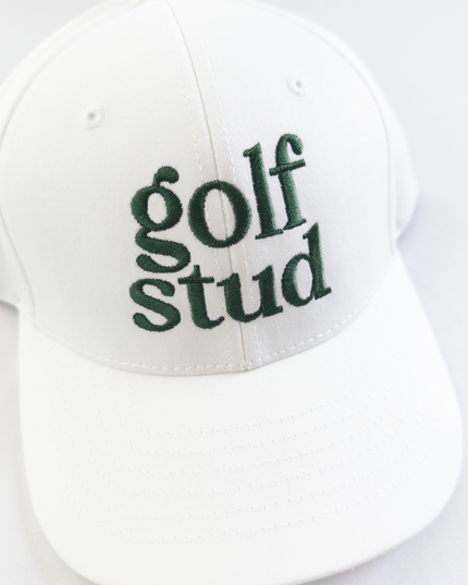 White golf hat with bold green embroidered text reading 'golf stud,' minimalist and stylish golf accessory perfect for young golfers and golf enthusiasts, displayed on a clean white background.