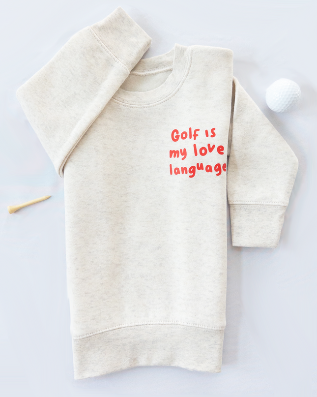 Beige sweatshirt with 'Golf is my love language' text on a white background