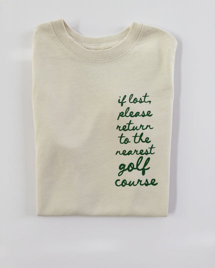 Beige sweatshirt with text 'if lost, please return to the nearest golf course' on a light gray background