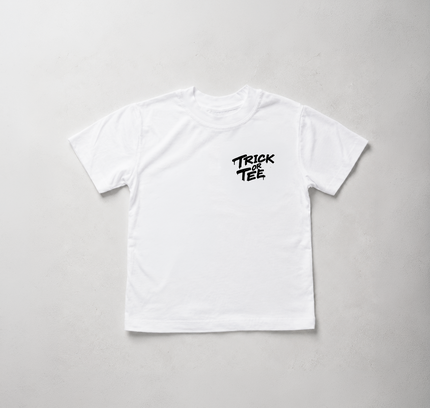A white short-sleeve crewneck t-shirt with a black 'TRICK TEE' logo printed on the left chest, laid flat on a light gray textured background.