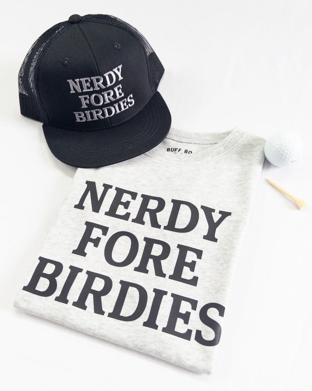 Black cap and white t-shirt with 'Nerdy Fore Birdies' text on a white background