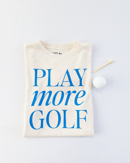 Beige t-shirt with 'PLAY more GOLF' text on a light gray background