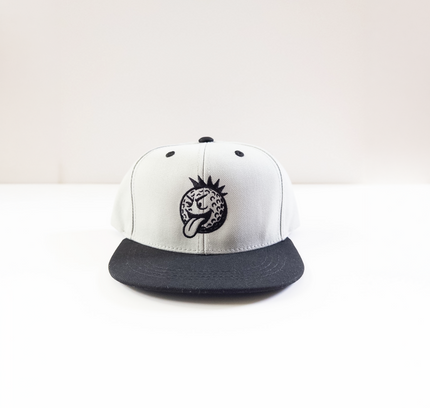 White and black cap with a logo on a white background