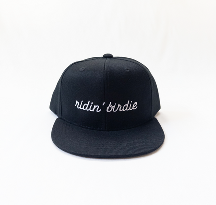 Black cap with 'ridin' birdie' text on a white background