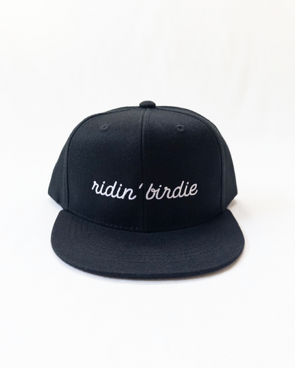 Black cap with 'ridin' birdie' text on a white background