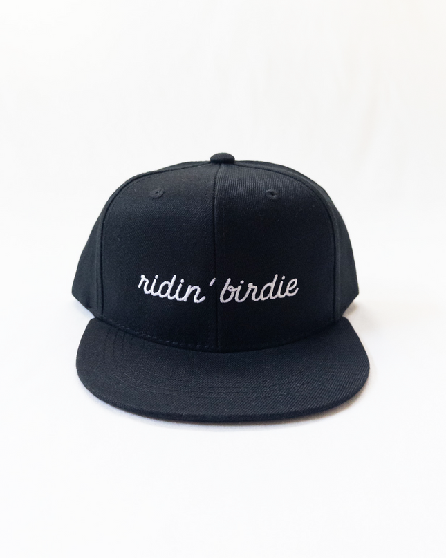 Black cap with 'ridin' birdie' text on a white background