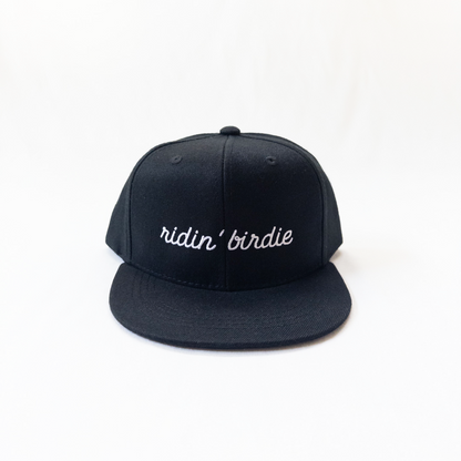 Black cap with 'ridin' birdie' text on a white background