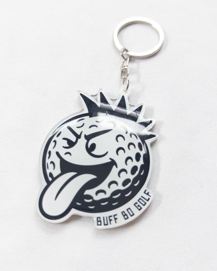 Keychain with a golf ball and crown design on a white background