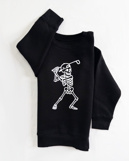 Black sweatshirt with skeleton playing golf design on a white background