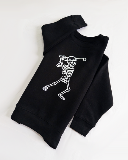 Black hoodie with a skeleton design on a white background