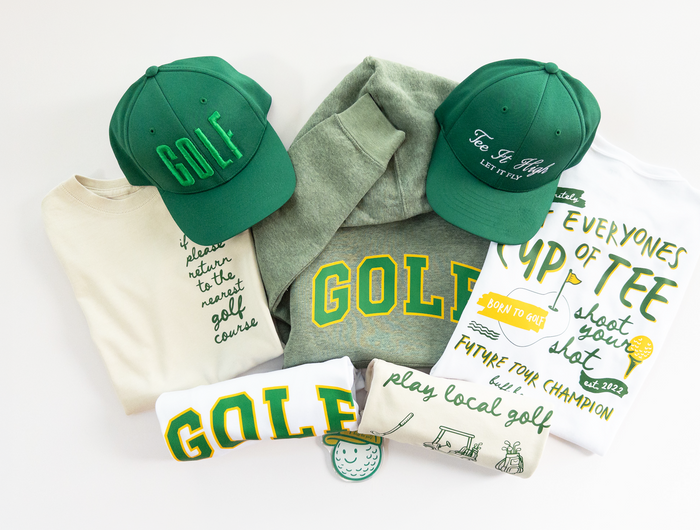 Green caps and t-shirts with 'GOLF' text on a white background