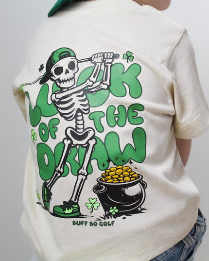 Person wearing a white t-shirt with a skeleton graphic and text on a plain background