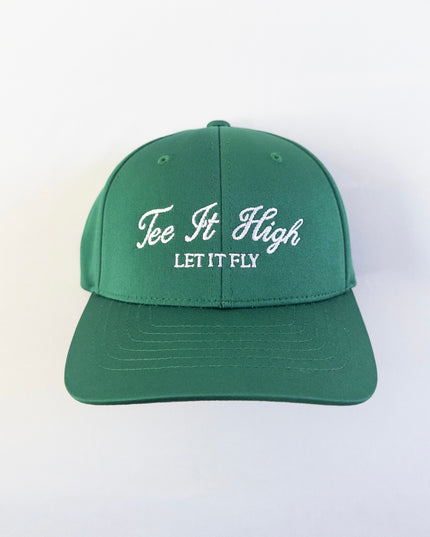 Green golf hat with white embroidered text reading 'Tee It High, Let It Fly,' classic and motivational golf headwear designed for young golfers and golf lovers, displayed on a neutral background.
