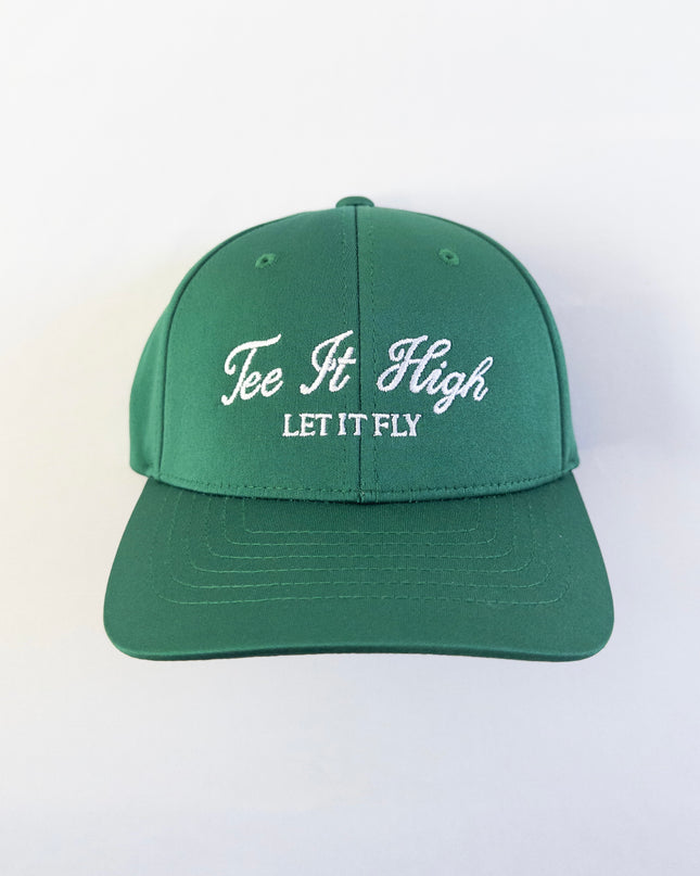 Green golf hat with white embroidered text reading 'Tee It High, Let It Fly,' classic and motivational golf headwear designed for young golfers and golf lovers, displayed on a neutral background.