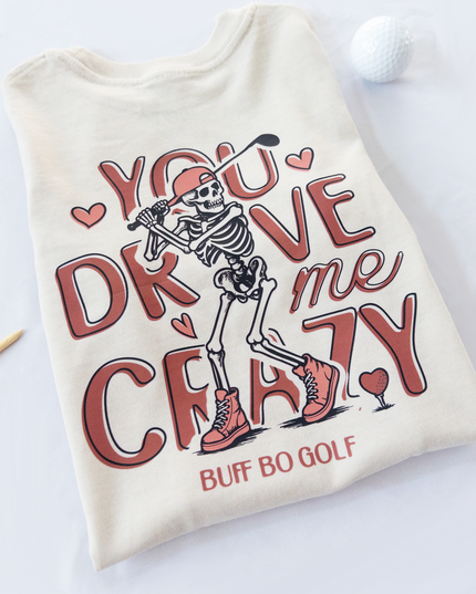 Beige t-shirt with skeleton design and text on a white background